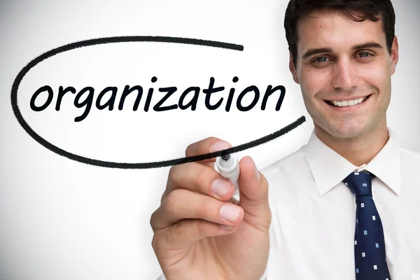Biznesmen pisząc słowo organizacji — Zdjęcie stockowe