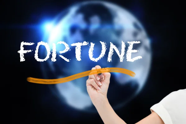 Empresaria escribiendo palabra fortuna — Foto de Stock
