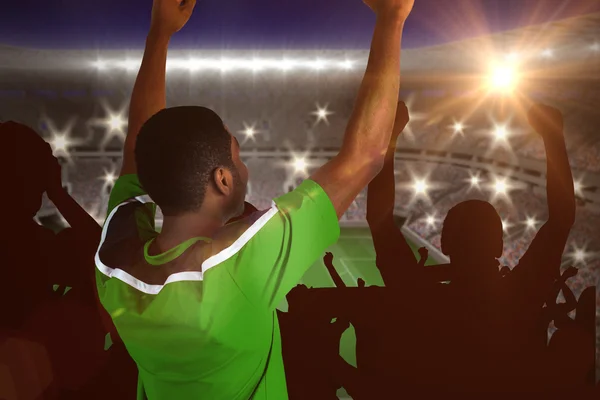 Cheering football fan in green jersey — Stock Photo, Image