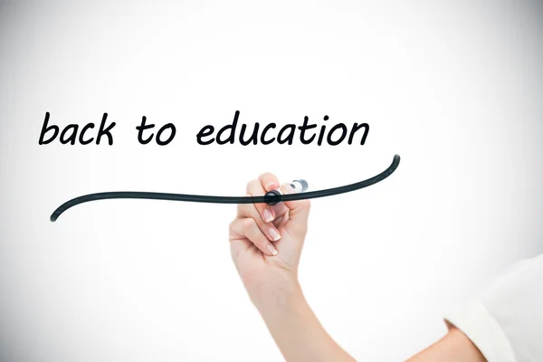 Businesswoman writing words back to education — Stock Photo, Image