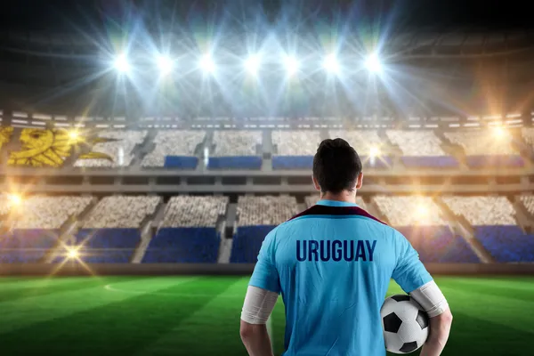 Uruguay futbol oyuncunun topa tutan birçok parçalardan oluşan imge — Stok fotoğraf