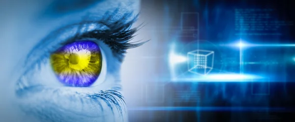 Green and yellow eye on blue face — Stock Photo, Image