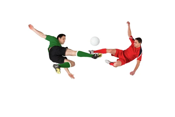 Football players tackling for the ball — Stock Photo, Image