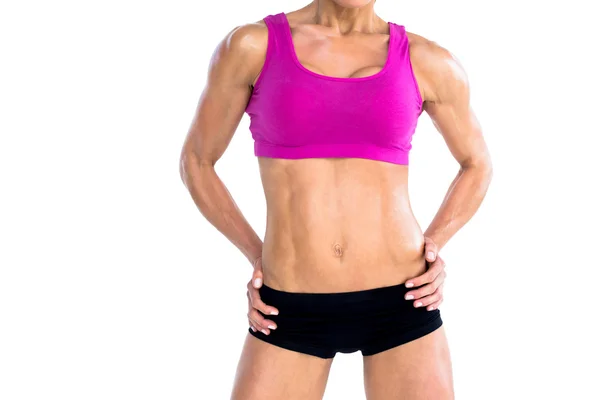 Female bodybuilder with hands on hips — Stock Photo, Image