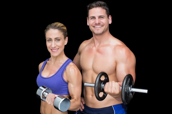 Crossfit couple posing with dumbbells — Stock Photo, Image