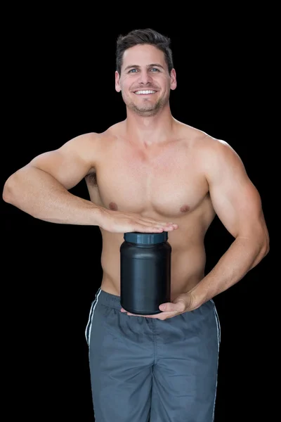 Homem muscular com suplemento nutricional — Fotografia de Stock