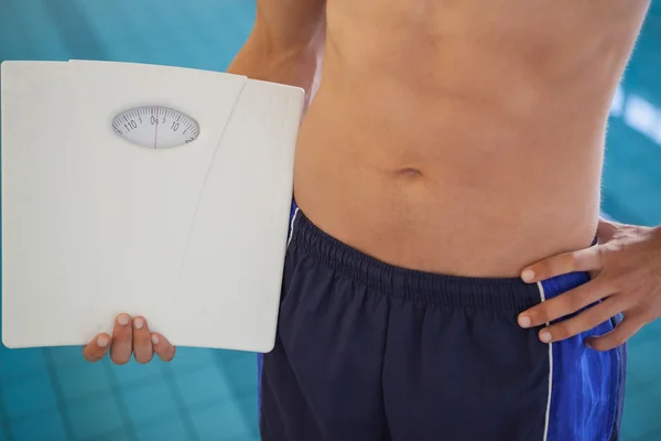 Fit man holding weighing — Stock Photo, Image