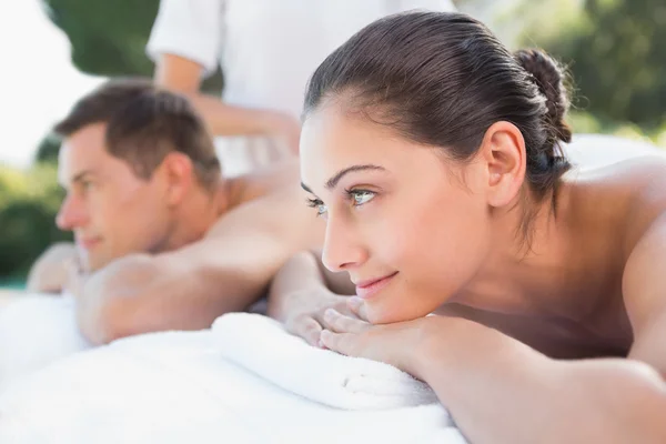Couple enjoying couples massage — Stock Photo, Image