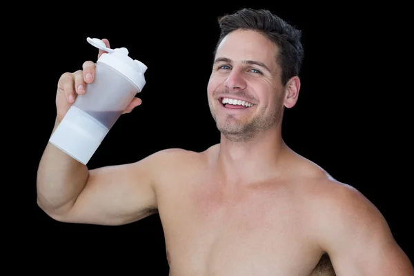 Muscular man holding protein drink — Stock Photo, Image