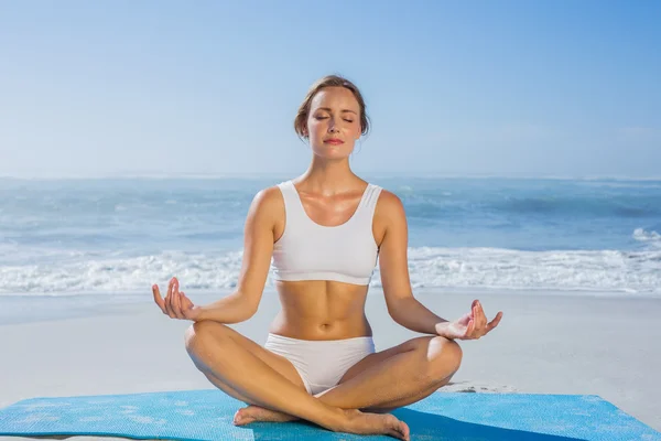 Woman sitting in lotus pose — Stock Photo, Image