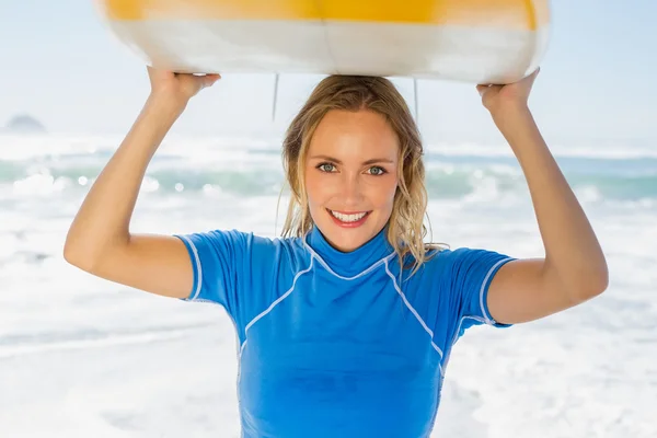 Blonde surfer holding her board — Stock Photo, Image