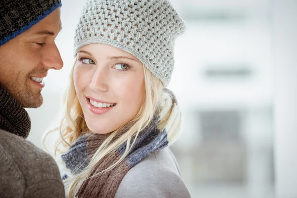 Couple in warm clothing hugging — Stock Photo, Image