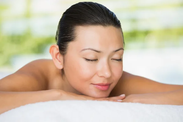 Brunette lying on massage table — Stock Photo, Image