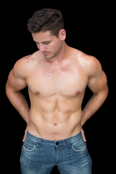 Muscular man posing in blue jeans — Stock Photo, Image