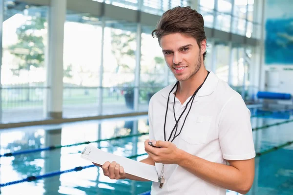 Swimming coach by the pool — Stock Photo, Image