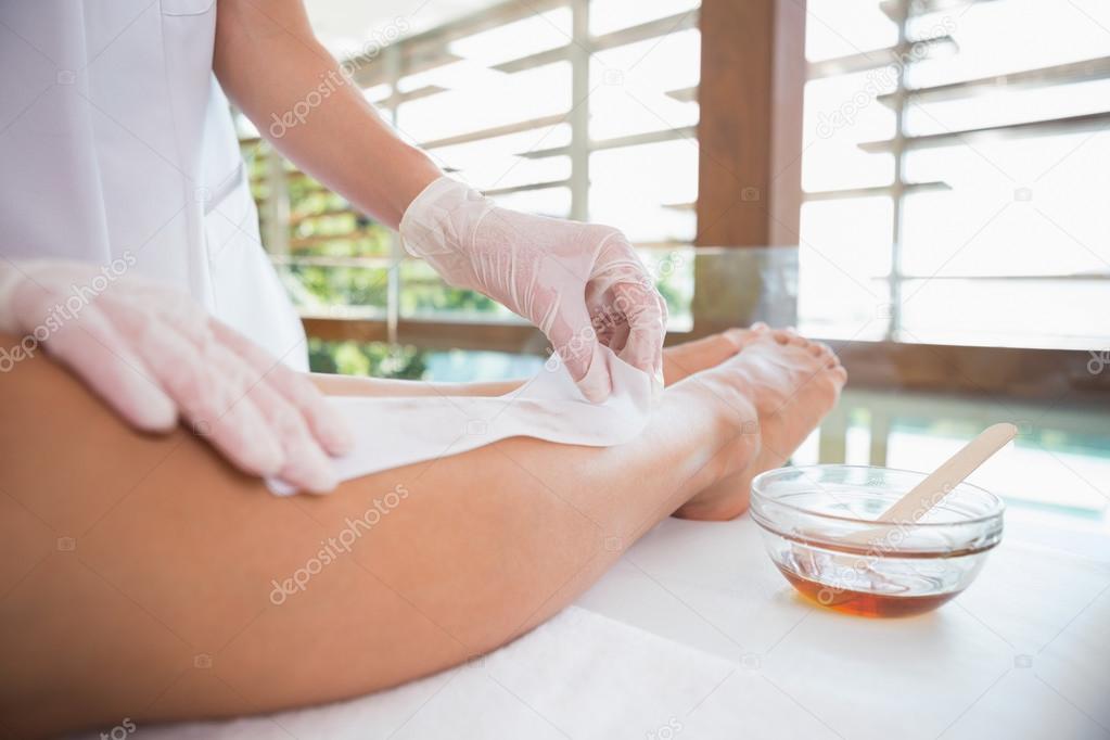 Woman getting her legs waxed — Stock Photo © Wavebreakmedia 48328131