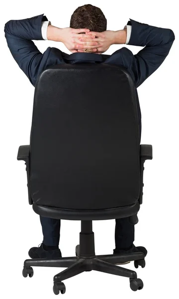 Empresário sentado em cadeira giratória — Fotografia de Stock