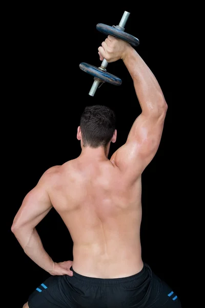 Strong crossfitter lifting up dumbbell — Stock Photo, Image