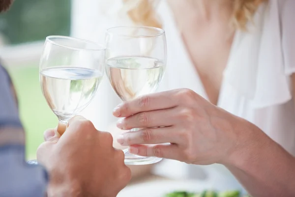 Couple toasting with white wine — Stock Photo, Image