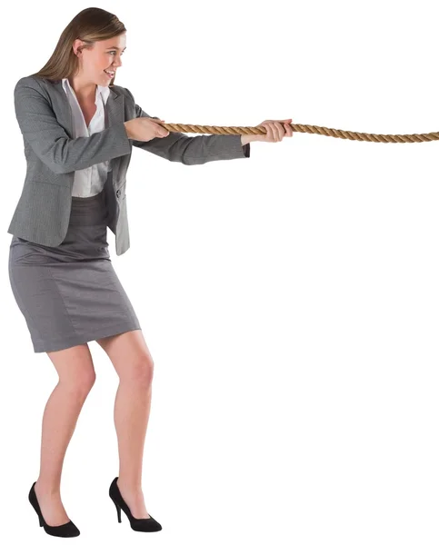 Businesswoman pulling a rope — Stock Photo, Image