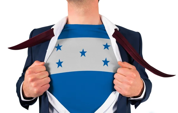 Businessman opening shirt to reveal honduras flag — Stock Photo, Image