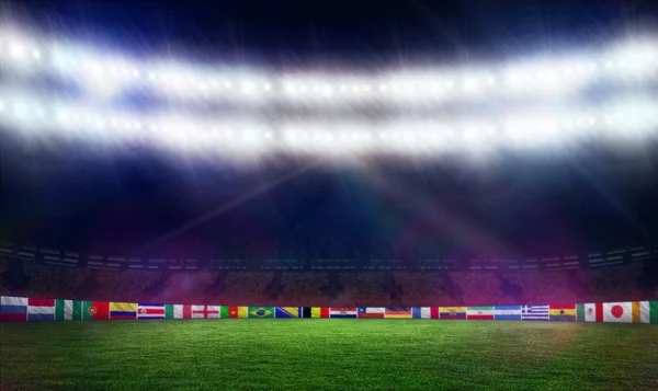 Campo de futebol com bandeiras da Copa do Mundo — Fotografia de Stock