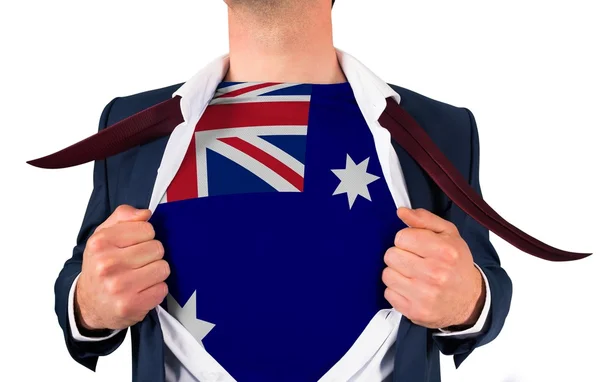 Бизнесмен открывает рубашку, чтобы показать флаг Австралии — стоковое фото