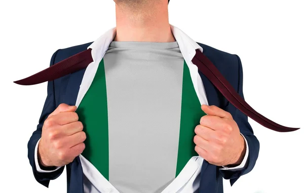 Businessman opening shirt to reveal nigeria flag — Stock Photo, Image