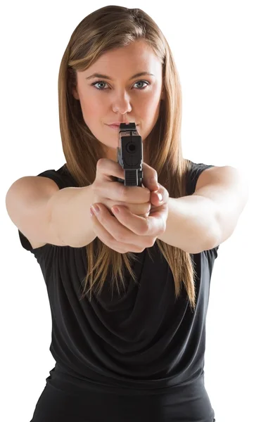 Femme fatale pointing gun at camera — Stock Photo, Image