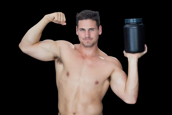 Hombre muscular con suplemento nutricional —  Fotos de Stock