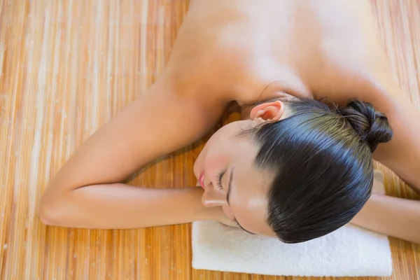 Brunette relaxing on massage table — Stock Photo, Image