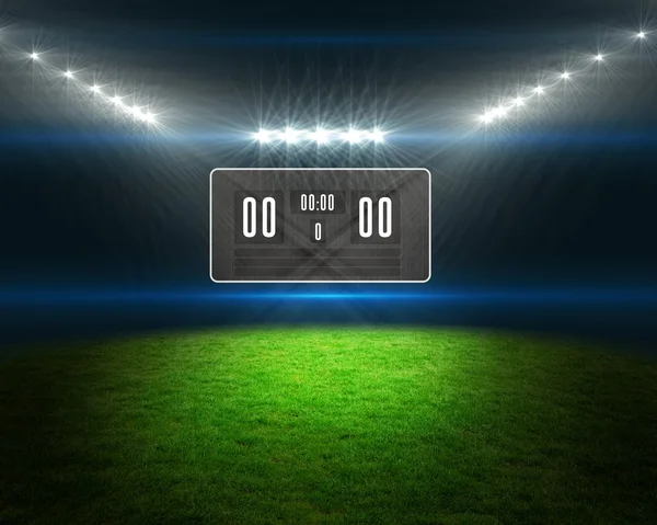 Football pitch with scoreboard and lights — Stock Photo, Image