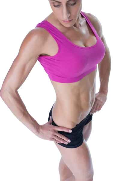 Vrouwelijke bodybuilder poseren — Stockfoto
