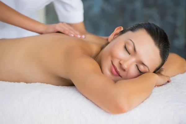 Brunette enjoying a back massage — Stock Photo, Image