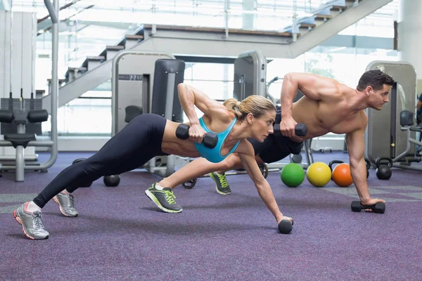 Bodybuilding man and woman  in plank position — Stock Photo, Image