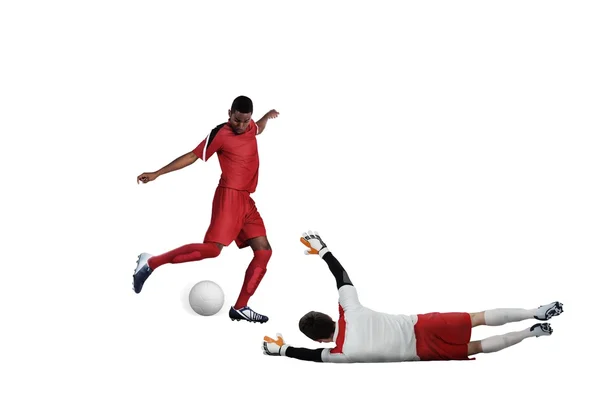 Football players tackling for the ball — Stock Photo, Image