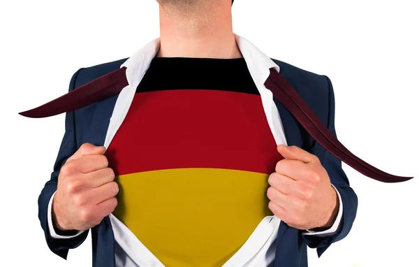 Businessman opening shirt to reveal germany flag — Stock Photo, Image