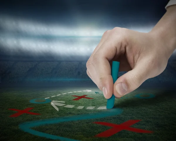 Hand tactiek puttend uit voetbalveld — Stockfoto