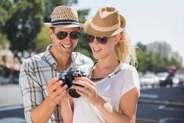 Hip couple looking at their camera — Stock Photo, Image