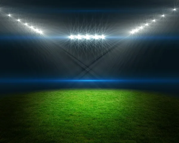 Campo de futebol com luzes brilhantes — Fotografia de Stock