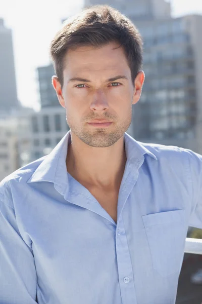 Handsome man on his balcony — Stock Photo, Image