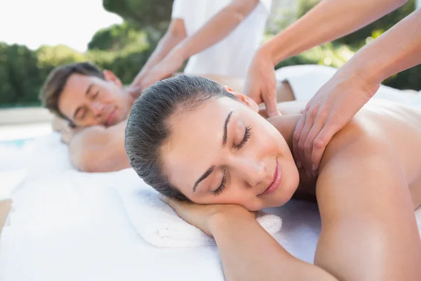 Couple enjoying couples massage — Stock Photo, Image