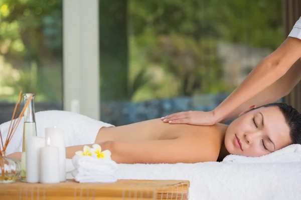 Relaxed brunette getting a back massage — Stock Photo, Image