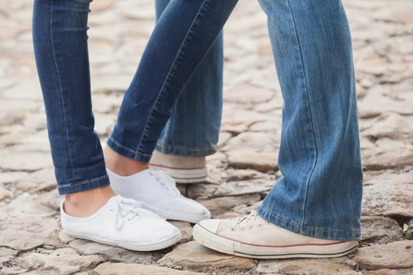 Couple in jeans standing on path — Stock Photo, Image