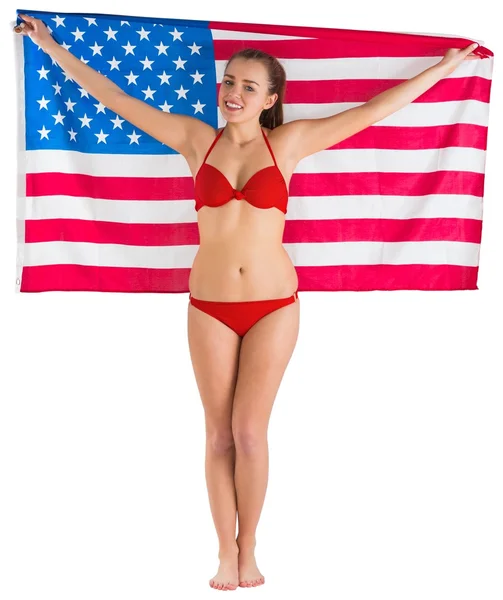 Mooi meisje in een bikini met Amerikaanse vlag — Stockfoto