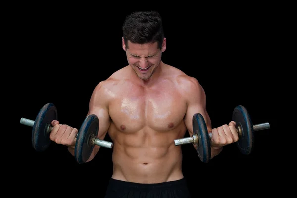 Strong crossfitter lifting up dumbbells — Stock Photo, Image