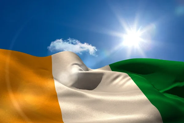 Ivory coast national flag under sunny sky — Stock Photo, Image