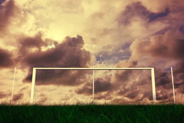 Football goal under cloudy sky — Stock Photo, Image