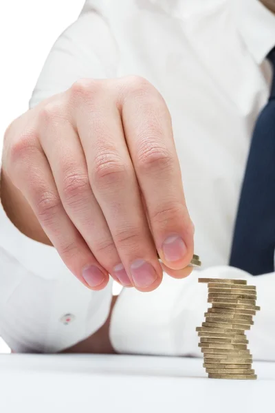 Businessman counting coins — Stock Photo, Image