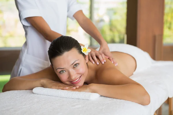 Brunette enjoying a peaceful massage — Stock Photo, Image